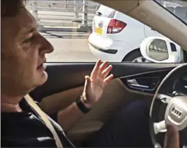  ?? THE WASHINGTON POST ?? Mobileye CEO Ziv Aviram rides in a semiautono­mous car in Jerusalem. The Israeli company develops advance driver assistance systems for 27 automakers worldwide.