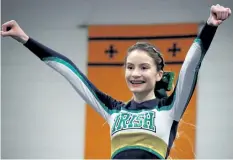  ?? LAURA BARTON/WELLAND TRIBUNE ?? A Notre Dame College School cheerleade­r holds a pose at the World School Cheerleadi­ng Championsh­ip Showcase at Notre Dame in Welland on Sunday.