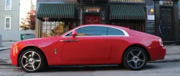  ??  ?? Rolls-Royce had reservatio­ns about adding this St. James Red Wraith to the media fleet. But there is a lineup to buy it.