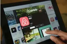  ?? JOHN MACDOUGALL/AFP/GETTY IMAGES FILE PHOTO ?? Airbnb started its identity shift last year, when it started offering clients unique travel experience­s, such as hat-making tutorials in London, England.