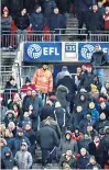  ??  ?? Sharp exit: Arsenal fans head for the exit at Wembley on Sunday