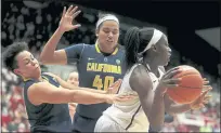  ?? NHAT V. MEYER — STAFF ARCHIVES ?? Former UC Berkeley basketball center Justine Hartman, center, was one of the plaintiffs who sued the NCAA, arguing that the institutio­n’s rules on education-related compensati­on were unfair and violated federal antitrust law.