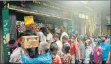  ?? AFP ?? People queue up to buy alcohol after the state announced a 15-day partial lockdown, in Siliguri on Saturday.