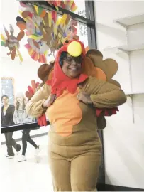  ?? ?? Jasmine Brown, special education teacher at Shepard High School, got the most food drive donations, plus the honor of wearing the costume.