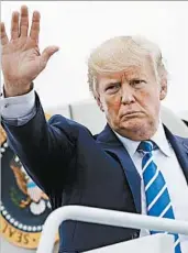  ?? PABLO MARTINEZ MONSIVAIS/AP ?? President Donald Trump boards Air Force One after meeting with his top national security aides at Camp David.