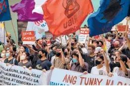  ?? JES AZNAR/THE NEW YORK TIMES ?? Protesters rally Tuesday in Manila against Ferdinand Marcos Jr. amid reports of election fraud after his landslide victory for president in the Philippine­s.