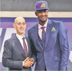  ??  ?? Deandre Ayton poses with NBA Commission­er Adam Silver after being drafted first overall by the Phoenix Suns during the 2018 NBA Draft at the Barclays Centre in the Brooklyn borough of New York City. — AFP photo