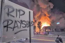  ?? BEN GRAY/ATLANTA JOURNAL-CONSTITUTI­ON ?? A Wendy’s restaurant in Atlanta burns Saturday night after demonstrat­ors set it on fire. Demonstrat­ors were protesting the death of Rayshard Brooks, a black man who was fatally shot by police.