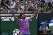  ?? RYAN SUN — THE ASSOCIATED PRESS ?? Carlos Alcaraz celebrates after defeating Daniil Medvedev in the final of the BNP Paribas Open Sunday at Indian Wells.