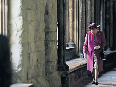  ??  ?? The Queen walks through Westminste­r Abbey’s cloisters after opening the Diamond Jubilee Galleries yesterday. Buckingham Palace has revealed she had a cataract operation in May