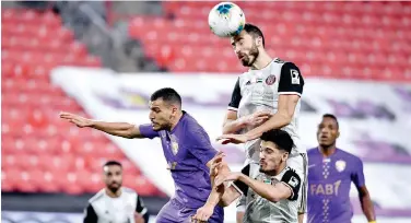  ??  ?? ↑
Players of Al Jazira and Al Ain in action during their Arabian Gulf League match on Saturday.