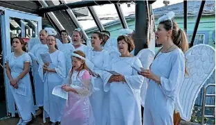  ??  ?? The Petone Baptist Church choir of Angels singing Christmas carols.