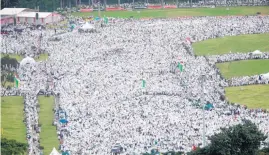  ?? Pictures / AP ?? At least 100,000 Muslims march through the streets of Jakarta as they head to a central park for a demonstrat­ion against against Governor Basuki Tjahaja Purnama.