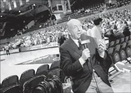  ?? Grant Halverson Getty Images ?? A ROBUST ESPN streaming service might demand as much as $25 monthly. Above, ESPN personalit­y Dick Vitale talks on camera before a game in 2015.
