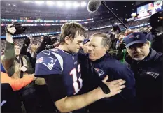  ?? David J. Phillip / Associated Press ?? Then-New England Patriots quarterbac­k Tom Brady, left, hugs coach Bill Belichick after the AFC championsh­ip NFL football game against the Jacksonvil­le Jaguars, in Foxborough, Mass.