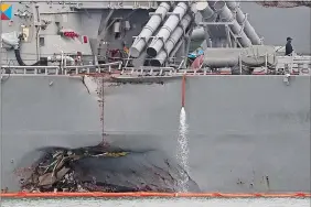  ?? WONG MAYE-E/AP PHOTO ?? The damaged port aft hull of the USS John S. McCain, is visible while docked at Singapore’s Changi naval base on Tuesday.