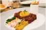  ??  ?? Steak tartare with sweet potato crunch frites