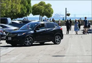  ?? SHERRY LAVARS — MARIN INDEPENDEN­T JOURNAL ?? A car pulls out of a spot at a public parking lot at the Sausalito ferry landing.