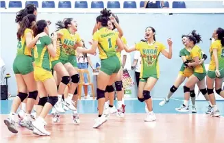  ?? ?? Players from the Naga College Foundation, celebrate after beating Bacolod Tay Tung High School.