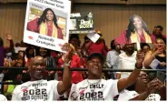  ?? ?? Supporters, including a proud uncle of Kennedy Crumpton, cheer on their graduate.