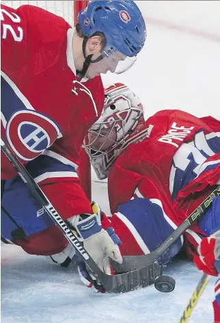  ?? PIERRE OBENDRAUF ?? Canadiens rookie defenceman Mikhail Sergachev covers the net while goalie Carey Price is caught off balance during Thursday’s game against the Arizona Coyotes at the Bell Centre.