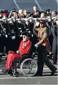  ??  ?? Bill Speakman, left, and Johnson Beharry, both holders of the Victoria Cross, parade during the Remembranc­e Sunday ceremony at the Cenotaph yesterday