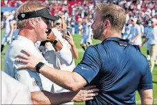  ??  ?? Rams head coach Sean McVay, right, greets Raiders coach Jon Gruden after their preseason game Aug. 18 in Los Angeles. KUO/THE ASSOCIATED PRESS] [KELVIN