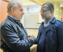  ?? PETER McCABE/THE CANADIAN PRESS ?? Michel Surprenant left, with Kouadio Frédéric Kouakou. “I told him to do everything he can to stay active,” Surprenant said. “As long as you stay active, you’re feeding your hope.”