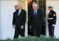  ?? MANUEL BALCE CENETA — THE ASSOCIATED PRESS ?? Senate Finance Committee Chairman Sen. Orrin Hatch, R-Utah, and members Sen. John Cornyn, R-Texas and Sen. Patrick Toomey, R-Pa., back left, walk from the the West Wing to speak to reporters after a meeting with President Donald Trump at the White...