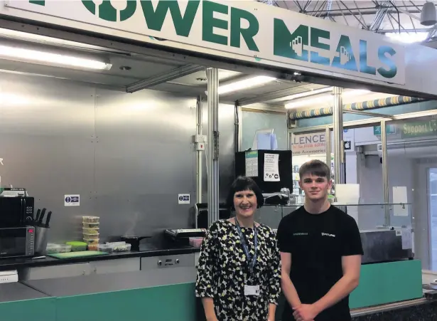  ??  ?? Power Meals owner Lucas Logan with Bridgend College entreprene­ur officer Ruth Rowe