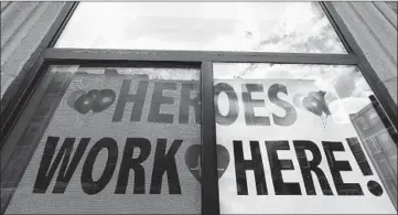  ?? STEVEN SENNE/AP ?? Massachuse­tts General Hospital’s North EndWaterfr­ont Health center honors health care workers in Boston. Medical administra­tors are scrambling to find enough nursing help.