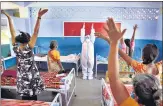  ?? PTI ?? A Nagercoil Corporatio­n worker leads a yoga session at a Covid Care Centre in Kanyakumar­i on Friday.