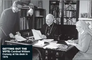  ?? ?? GETTING OUT THE VOTE: Cardinal William Conway at his desk in 1975