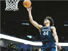  ?? JEFF DEAN/AP ?? Connecticu­t guard Andre Jackson Jr. shoots during the second half of Saturday’s game against Xavier in Cincinnati.