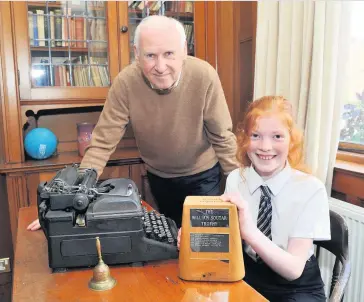  ??  ?? Great effort Iain Mackintosh, chairman of the Friends of William Souter with Chloe Mackay from Viewlands Primary, winner of the 2019 Bairnrhyme­s Competitio­n