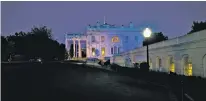  ?? DOUG MILLS/THE NEW YORK TIMES ?? The sun sets at the White House on Monday. The disclosure that President Donald Trump shared classified informatio­n with senior Russian officials was a new blow to an already dispirited and besieged White House staff, which has been left confused and...