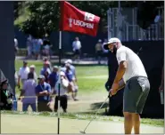  ?? NANCY LANE / BOSTON HERALD ?? Jon Rahm putts on the 18th green during a practice round at the U.S. Open at The Country Club on Wednesday.