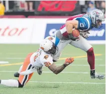  ?? GRAHAM HUGHES/ THE CANADIAN PRESS ?? Alouettes’ Eric Deslaurier­s, right, breaks away from B.C. Lions’ Ryan Phillips in the first half on Friday.