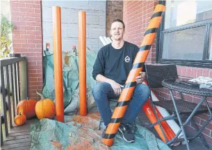  ?? STEVE RUSSELL PHOTOS TORONTO STAR ?? Geoff Burke is behind an initiative with the Daily Bread Food Bank to install candy chutes in front of people’s porches so kids can trick-or-treat while maintainin­g physical distancing.