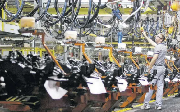  ?? (Photo: AFP) ?? FLINT, United States — A worker assembles General Motors (GM) trucks on the assembly line at the GM Flint Assembly plant in Flint, Michigan.