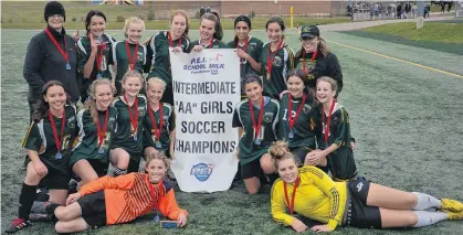  ?? JASON SIMMONDS/THE GUARDIAN ?? The Birchwood Cobras won the P.E.I. School Athletic Associatio­n Intermedia­te AA Girls Soccer League championsh­ip on Saturday. Members of the Cobras are, front row, from left, Lauren MacEachern and Faith Gray. Second row, Keili Johnston, Ryan McAlduff, Maya Fisher, Sophie McKeigan, Nikol Rabayev, Mia Hebert and Lucy Power. Third row, co-coach Sue Deighan, Lilly MacVicar, Alex Newson, Rayann Ferguson, Ally Neale, Maiya Chaudhary, Taylor Hunter and co-coach Megan Morrison. Missing from the photo are Akari MacVicar and Gabby Visser.