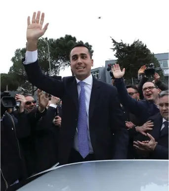  ?? (Reuters) ?? 5-STAR MOVEMENT leader Luigi Di Maio waves as he leaves after casting his vote at a polling station in Pomigliano d’Arco, Italy.