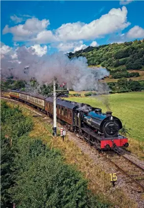  ?? ?? Great Central Railway-based Hudswell Clarke Austerity 0-6-0ST No. 68067 has gone on hire to the Llangollen Railway for several weeks while repairs are completed to GWR 2-8-0 No. 3802. This drone view sees 1943-built No. 68067 leaving Carrog on August 27. HOWARD PEARSON