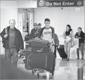  ?? Christina House For The Times ?? MAURICIO GOMEZ arrives at Los Angeles Internatio­nal Airport from El Salvador on Feb. 9.