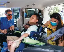  ?? Yi-Chin Lee / Staff photograph­er ?? Elda Garza follows Adaptive Driving Access Mobility Specialist Jeff Mulloy’s instructio­ns for her son, Miguel Ramirez, in the new van supplied by Houston Children’s Charity.