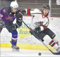  ?? T.J. COLELLO/CAPE BRETON POST ?? Jared Ostroski of the Mount Pearl Junior Blades, left, chases Nolan Smith of the Kameron Junior Miners during the second period of play.