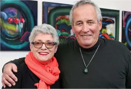  ??  ?? Patrick and Ros Walshe in front of some of his paintings at Origin Gallery. Photo: Steve Humphries