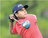  ?? JARED C. TILTON/GETTY IMAGES ?? Sebastian Munoz of Colombia tees off the 11th hole on Thursday. He had five birdies on the back nine for a 61.