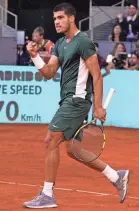  ?? AP ?? Carlos Alcaraz celebrates after winning a point against Alexander Zverev during the Madrid Open final on Sunday.