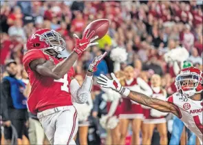  ?? [VASHA HUNT/ASSOCIATED PRESS FILE PHOTO] ?? Alabama wide receiver Jerry Jeudy (4) catches a touchdown pass during the Oct. 26 game against Arkansas in Tuscaloosa, Ala.